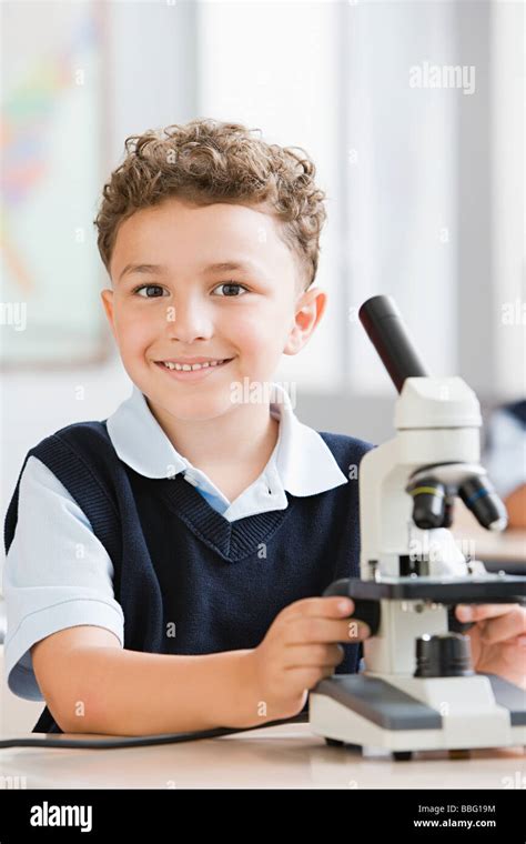 Schoolboy with microscope Stock Photo - Alamy