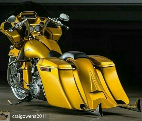 a yellow motorcycle parked in a garage