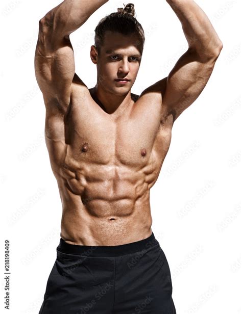 Sporty man showing off his muscular physique and six pack abs. Photo of ...