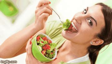 another women eating salad while laughing - Imgflip