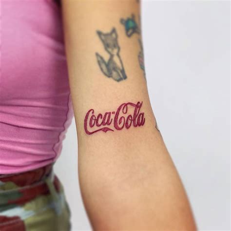 Coca-Cola tattoo on bicep