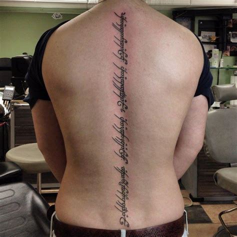 LOTR - Elvish tattoo down spine by Benjamin Jenness: TattooNOW