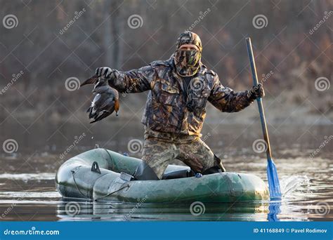 Hunter with a Duck in a Boat Stock Image - Image of wild, hobbies: 41168849