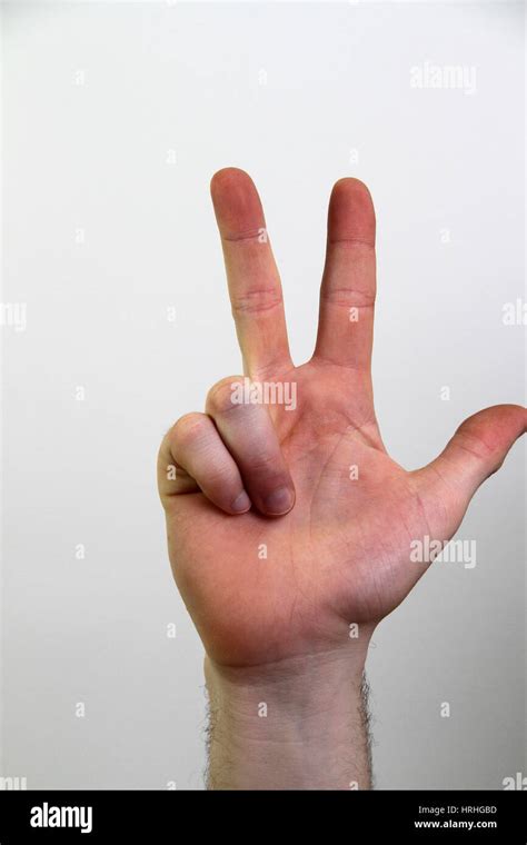 Hand signing number three Stock Photo - Alamy