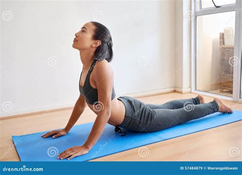 Woman Practicing Indoor Yoga Stock Image - Image of concentration, flexibility: 57484879