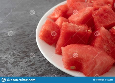 Plate of Watermelon Chunks on a Gray Mottled Table Side View Stock ...