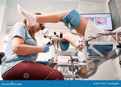 Gynecologist Examining Female Patient with Colposcope. Stock Photo ...