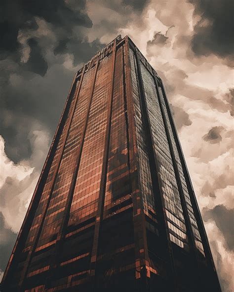 Premium AI Image | A tall building with a cloudy sky in the background