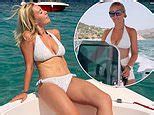 Laura Hamilton displays her toned physique while sporting a white b...