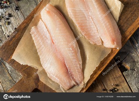 Raw White Organic Tilapia Fish Stock Photo by ©bhofack2 316516258