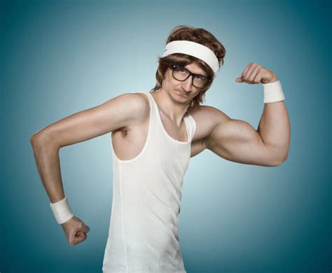 Funny retro nerd flexing his muscle over blue background | Health ...