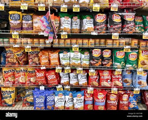 Snack chip selection at grocery store Stock Photo - Alamy