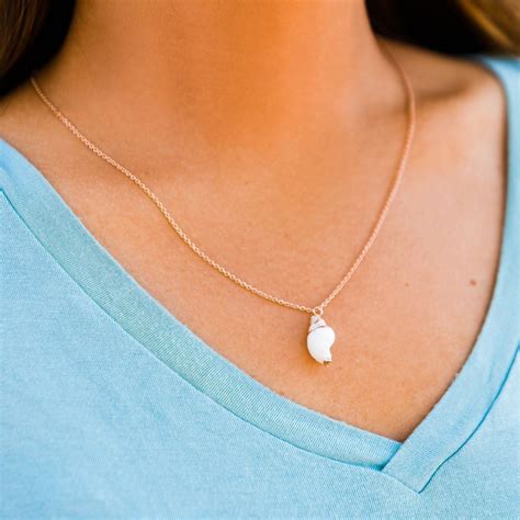 Beachy but elevated is the vibe with the Conch Pendant Necklace! A ...