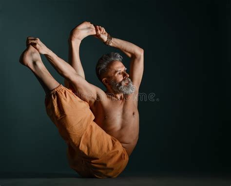 Old Man with Grey Beard Doing Yoga, Pilates, Fitness Training, Stretching Exercise, Asana or ...