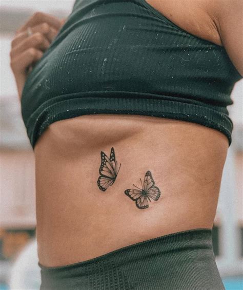 Butterfly couple tattoo done on the rib.