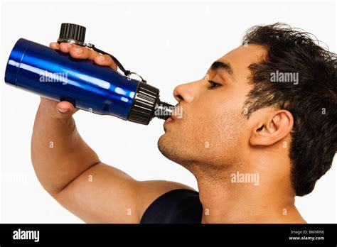 Man drinking water from a bottle Stock Photo - Alamy