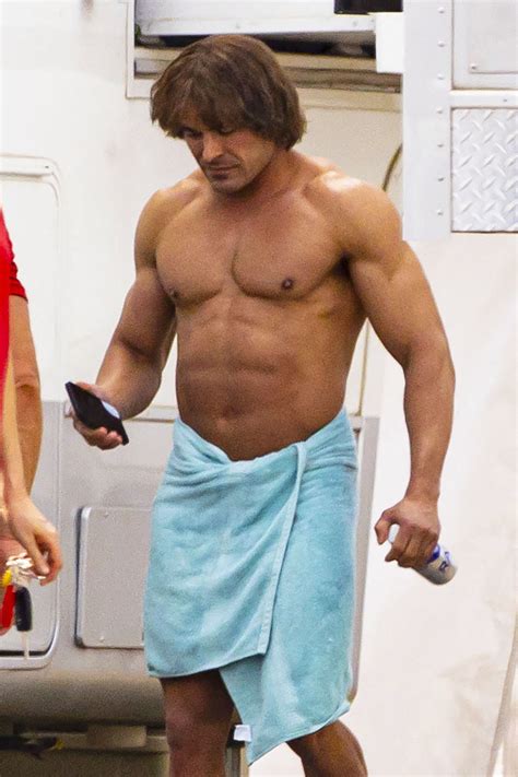 Zac Efron is unrecognizable with beefed up physique, bowl haircut