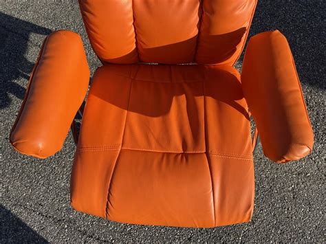 www.M37Auction.com: Orange Office Chair - Swivels, Height Adjustable, & Reclines