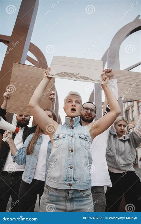 Group of Activists Giving Slogans in a Rally. Men and Women Marching ...