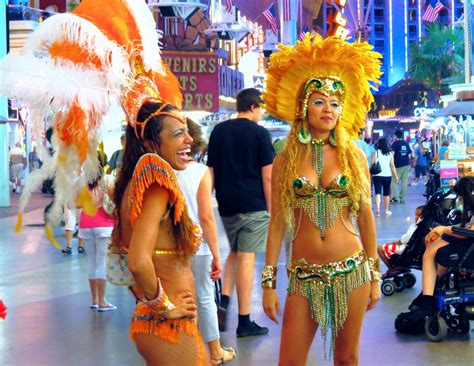 2 show girls hanging on Fremont street in Las Vegas Planet Hollywood ...