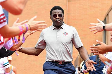 CANTON, OH – AUGUST 06: Hall of Fame wide receiver Michael Irvin celebrates with fans as he is ...