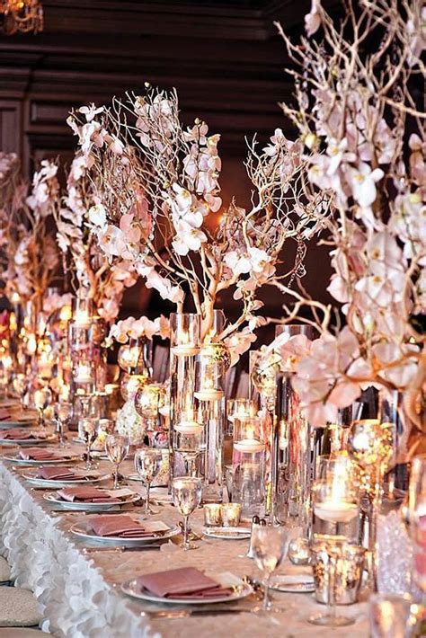 rose gold wedding decor on the table candles and white orchids on golden branches tracey br ...