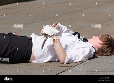 St. John Ambulance volunteer simulating an injured hand impaled on a ...