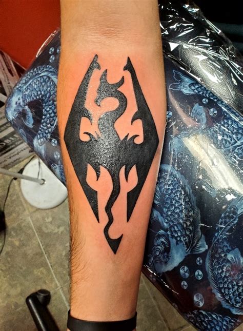 2nd tattoo, got the Skyrim logo | Fandom