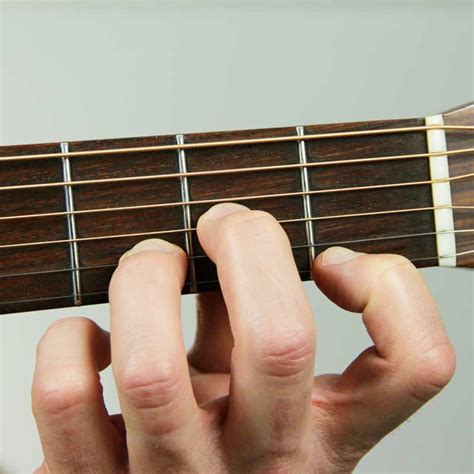 How to Play a D Minor Chord - Notes on a Guitar