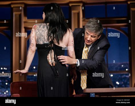 Margaret Cho, left, shows off her tattoos to host Craig Ferguson during a segment of 'The Late ...