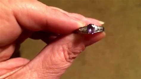 My alexandrite ring changing colors - YouTube