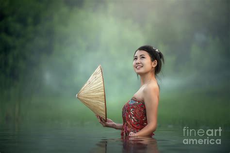 Thai Woman bathing in the river Photograph by Sasin Tipchai - Fine Art ...