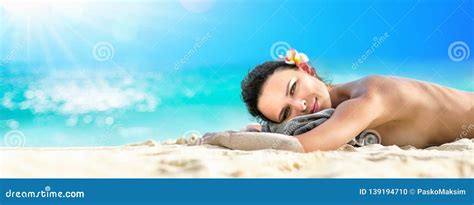 Beautiful Girl Lying Down Under the Sun Tanning in a Tropical Beach Stock Photo - Image of ...