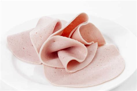 Plate of Bologna sausage, close up stock photo