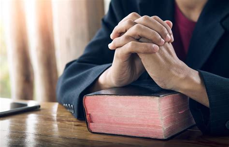 Christian man praying with the Bible, Pray and worship concept. 8034949 Stock Photo at Vecteezy