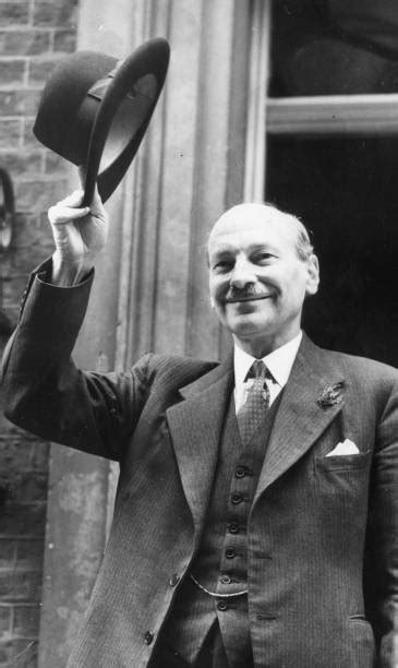 Attlee Raises Hat Pictures | Getty Images