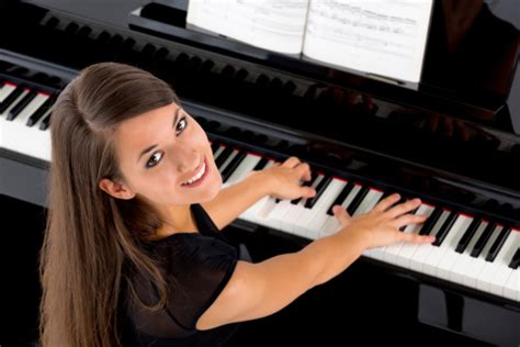 Beautiful Female Piano Player Stock Photo - Download Image Now - iStock