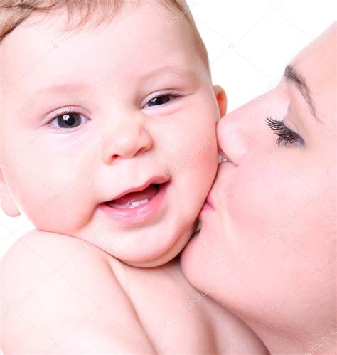 Happy young mother kissing a baby — Stock Photo © vnn83 #4514219