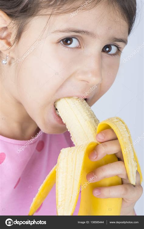 Child eating banana — Stock Photo © biljuska1 #138585444