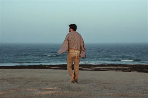 man-walking-on-the-beach-towards-shore image - Free stock photo ...