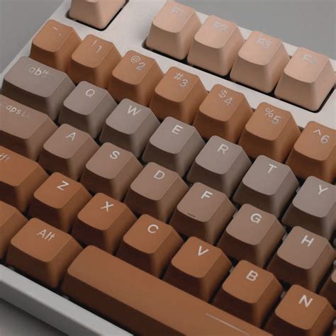 a computer keyboard with brown keys on it