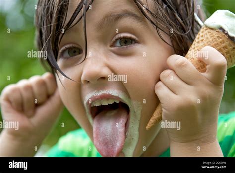 Young boy sticks out tongue hi-res stock photography and images - Alamy