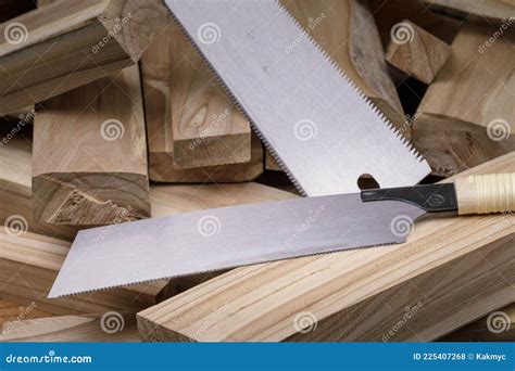 Hand saw and wood planks stock photo. Image of metal - 225407268