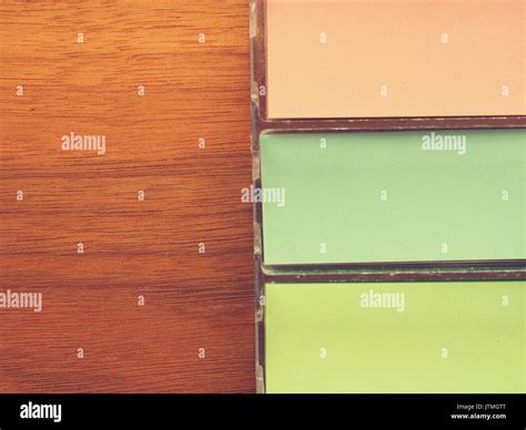 Colorful sticky notes on a wooden office table with space for text Stock Photo - Alamy