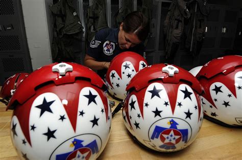 Technical Sgt. Amber Alumpe, an aircrew flight equipment specialist, repairs a Thunderbird ...