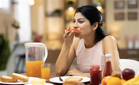 People Eating Breakfast On The Go