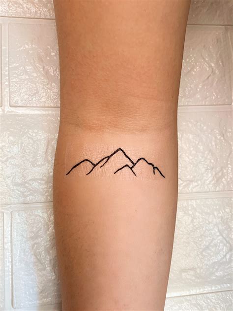 Simple Mountain Range Outline Tattoo