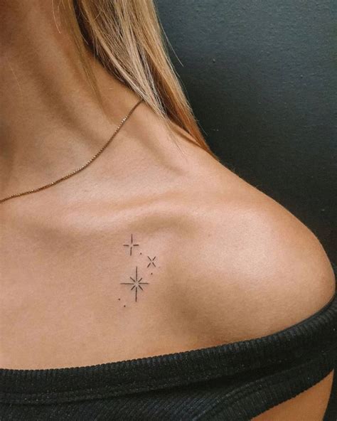 Minimalistic stars tattoo located on the collarbone,