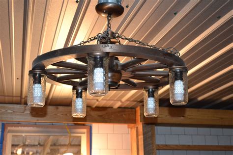Reworked a 50 year old wagon wheel chandelier to a new fixture. Note: use LED light bulbs ...