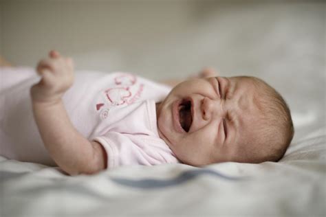 Baby crying in sleep: What's normal and how to soothe them